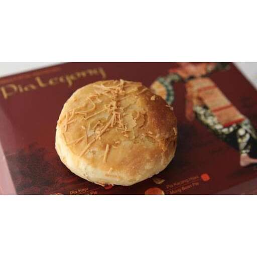 a roll on a table with a picture of a sandwich on it.