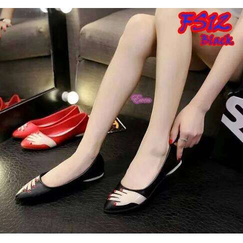 a pair of black shoes with a woman's legs.