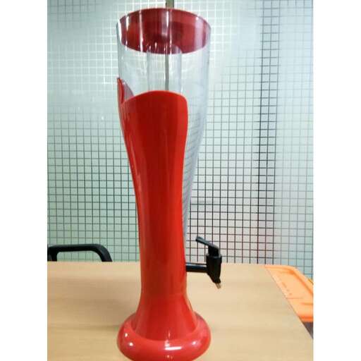 a red glass vase with a glass inside of it.