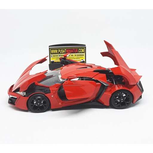 person is a car made of plastic and a battery operated toy.