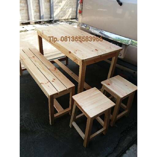a wooden bench sitting next to a van.