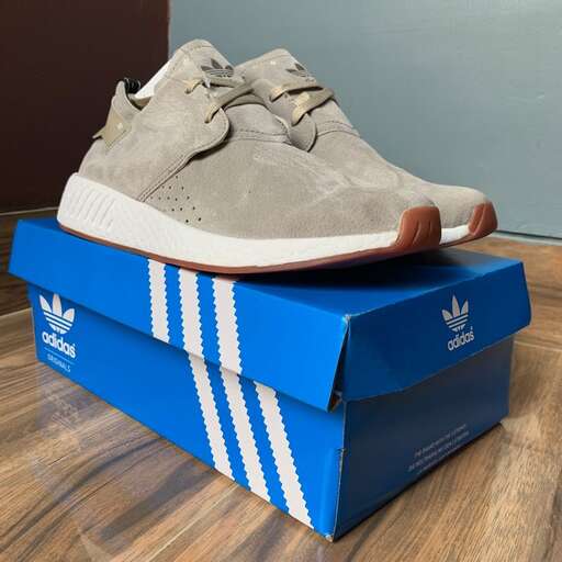 a pair of adidas shoes in blue and white.