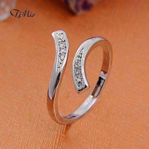 a sterling silver ring with a diamond in the middle.