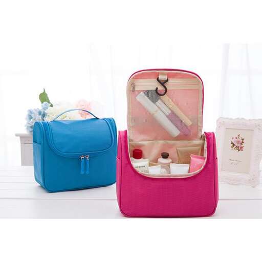 a pink and blue bag with a toothbrush in it.