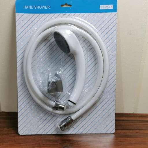 a white cord is wrapped in a blue and white paper.