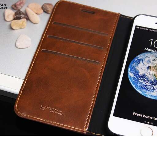 a brown leather wallet with a cell phone on it.