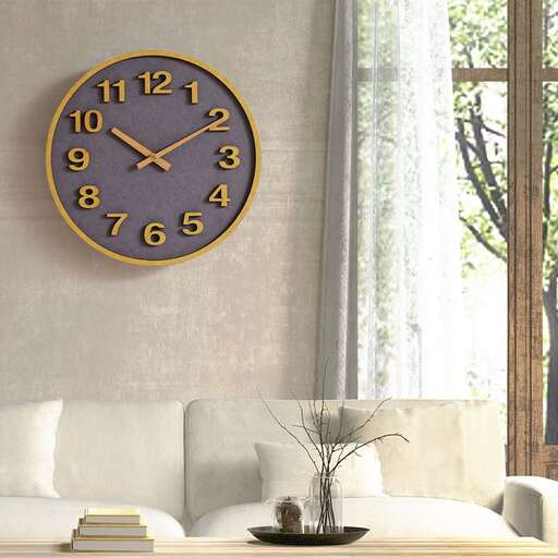 a clock is hanging on the wall above a couch.