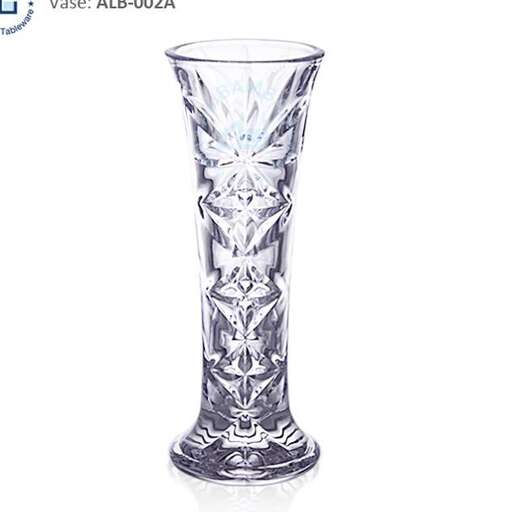 a tall glass candle holder with a design on it.