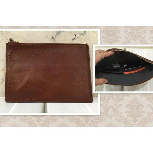 a brown leather wallet with a black leather case.