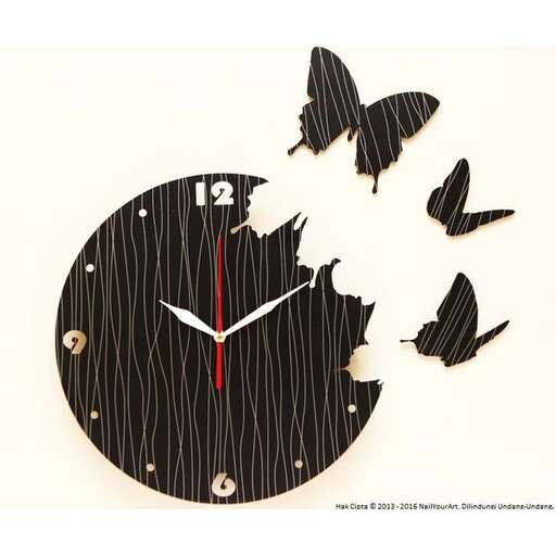 a clock with butterflies on it.