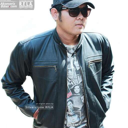 a man in a black leather jacket and sunglasses