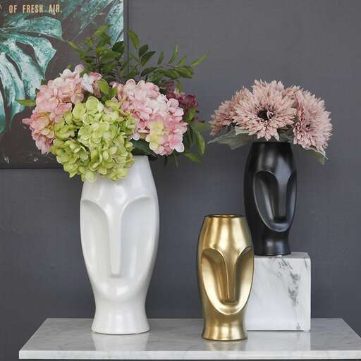 a couple of vases that are on a table