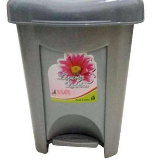 a plastic trash can with a flower on it