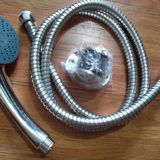 a ball and a ball of metal are on a table.