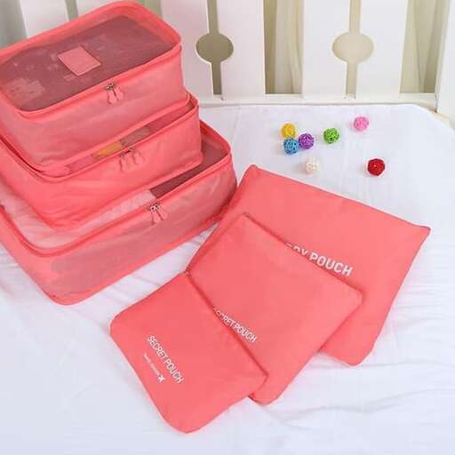 a bed with a pink bag and some toys