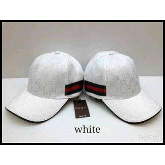 white baseball cap with a black stripe.