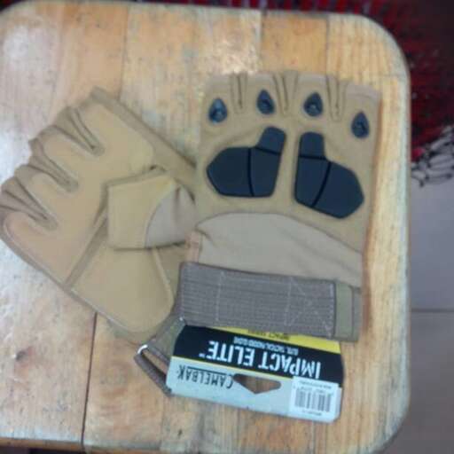 a pair of gloves on a wooden cutting board.