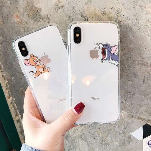 a person holding a phone in their hand.