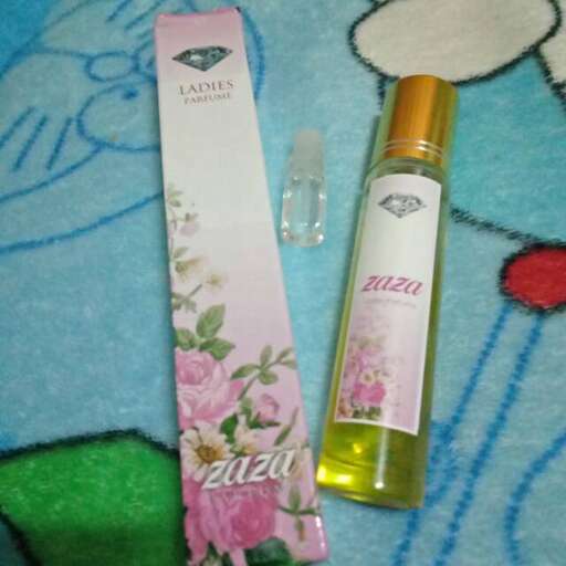 a bottle of perfume on a blanket