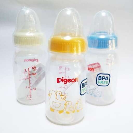 three baby bottles with lids on a white background.