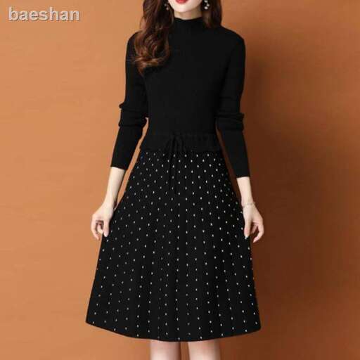 a little black dress with a little polka dot on the front