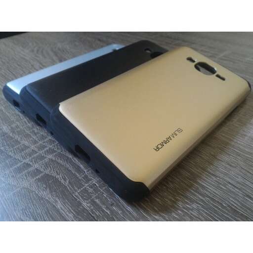 a cell phone sitting on a table with a wooden surface.