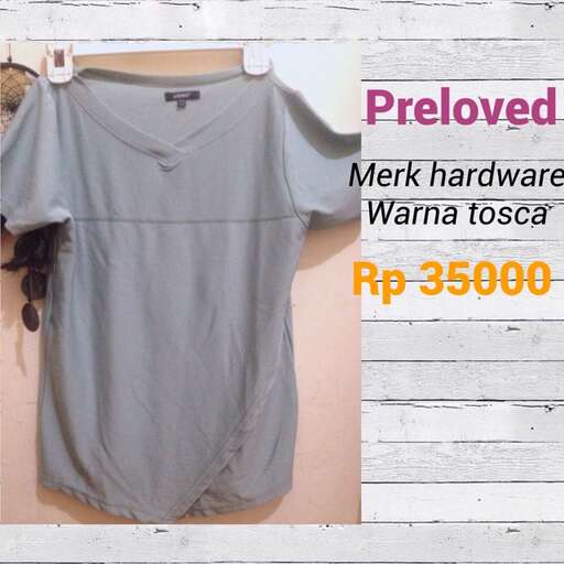 a shirt that is hanging on a wall.