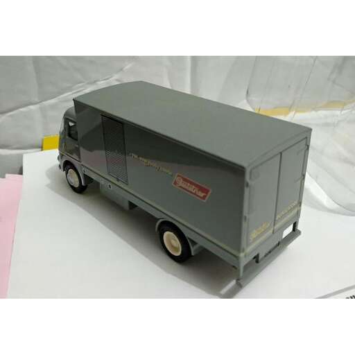 a small truck with a large front wheel