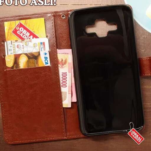 a brown leather wallet with a cell phone inside.