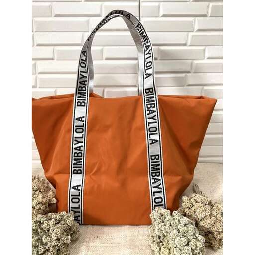 this bag is made from a recycled leather and has a large white flower bouquet in the center.