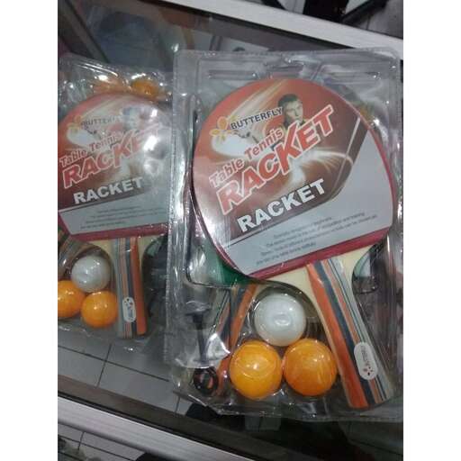 a display case filled with oranges and other items.