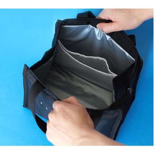 a person is putting a bag in a bag.