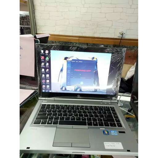 a laptop computer with a game on the screen.