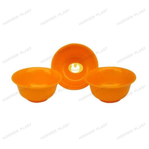 set of orange plastic bowls with a white background