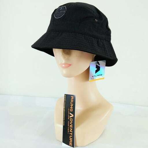 a mannequin wearing a black hat with a tag.