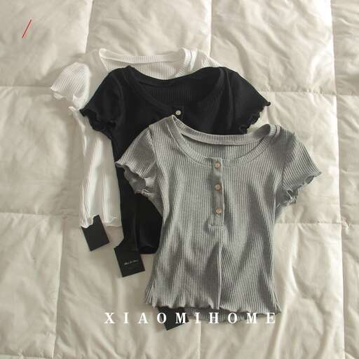 a gray and white shirt and some black and white clothes