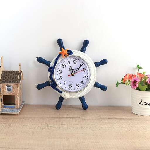 a clock with blue decorations and a white wall clock.