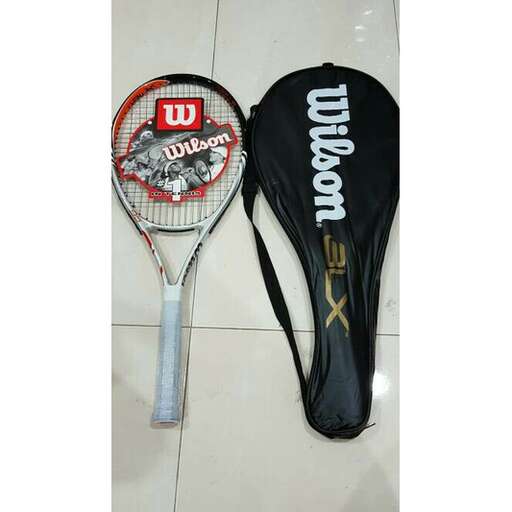 a tennis racket and a tennis racket on a tile floor.