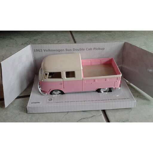 a toy truck is in a box with a door.