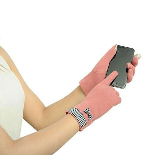 a woman holding a cell phone in her hands.