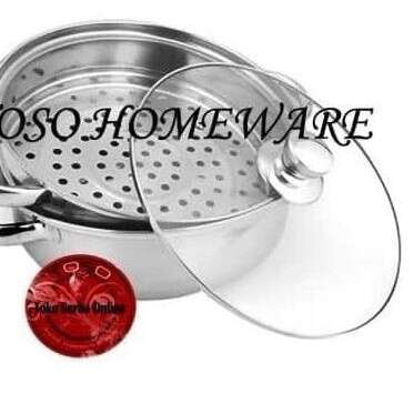a kitchen sink with a metal pot on it.