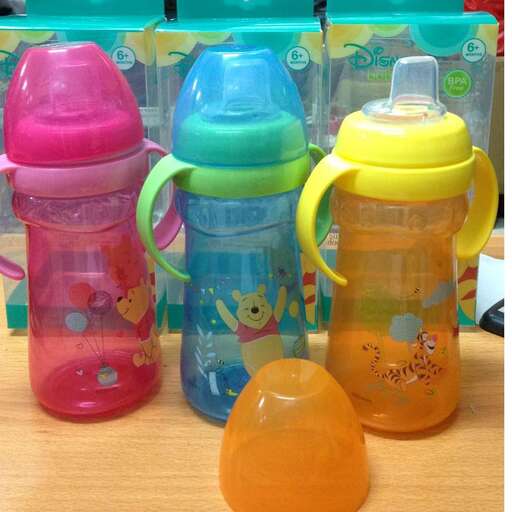 a plastic water bottle with a yellow lid.