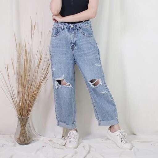 a pair of jeans with holes in the pockets.