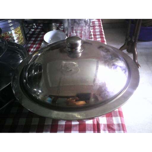 a large metal plate sitting on top of a table.