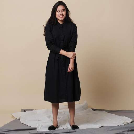 a woman in a long black dress