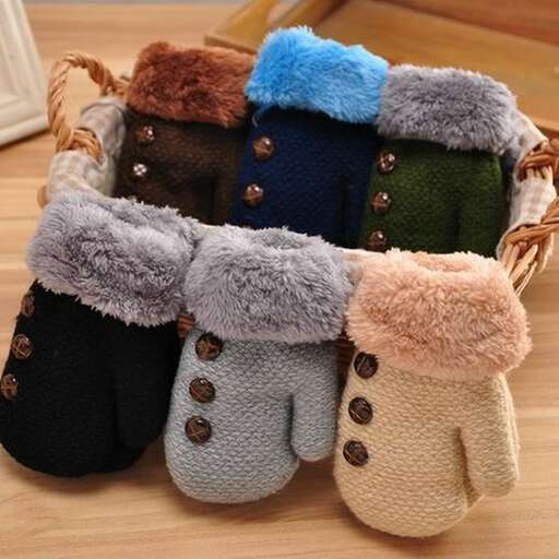 a group of knitted knitted stuffed animals in a basket.