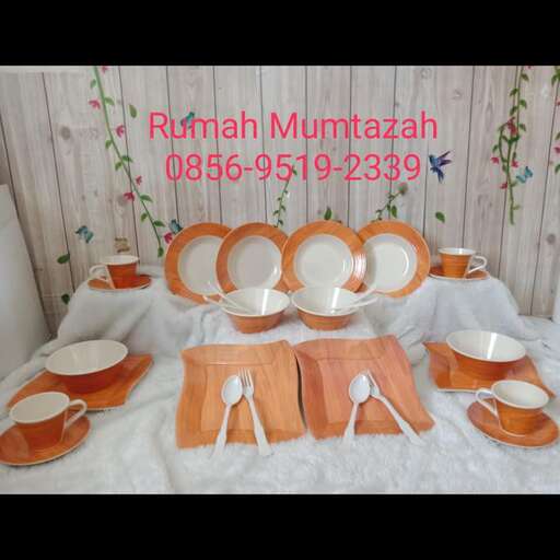 a table set for two with plates and plates.