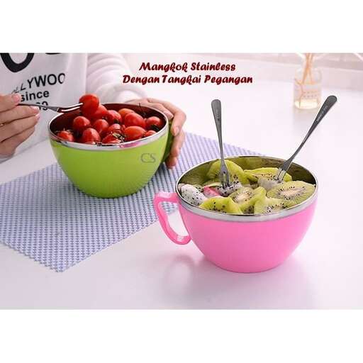 a person is holding a bowl of fruit and a bowl of fruit.