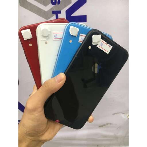 a person holding a smart phone in their hand.