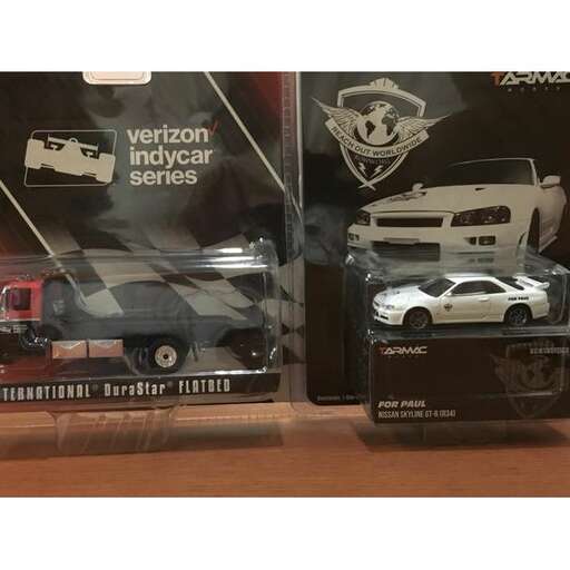 a display of a toy car and a car.